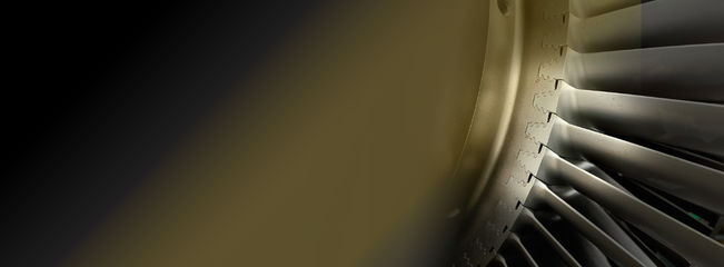 Close-up of a turbine blade showing precision-machined surfaces and blade geometry.