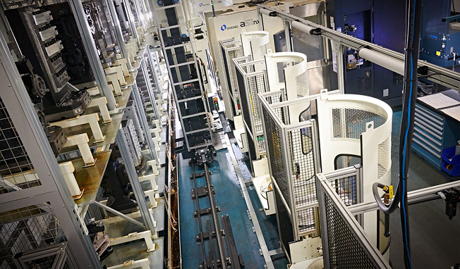 AUT - 6 Automated CNC machining line with Makino machining centres connected by a pallet handling and storage system for high-volume production.