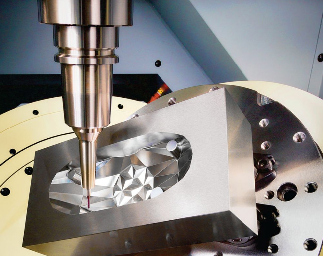 High-precision 5-axis CNC machining with touch probe inspection on complex aluminium component, demonstrating advanced milling accuracy and surface finish.